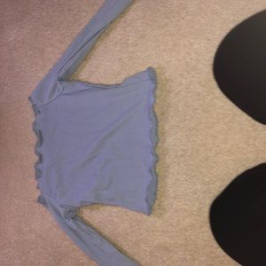 Off the shoulder light blue fringed shirt